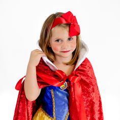 This Snow White Princess Cloak is a great costume accessory for any princess! The Cloak is made from 2 layers of 100% Polyester Crushed Velour with a white satin collar and red satin ribbon tie.Sizing: Kids - 30" long Adult - 46" long Adult - 56" long Care: Spot clean. Hang to dry. This Snow White Princess Cloak is Made to Order. Please allow additional time for our team to create this custom cloak before it is shipped out. For more information on our current production times, please see our Shipping Policy. Red Halloween Cosplay Costume For Role Play, Red Costumes For Role Play And Cosplay Events, Red Themed Costume Accessories For Cosplay, Red Costume For Cosplay Party, Red Costume Accessories For Cosplay Events, Red Themed Event Costume, Red Princess Costume For Costume Party, Red Christmas Costume Accessories For Costume Party, Red Christmas Costume Accessories