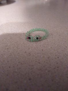 two green bracelets sitting on top of a counter