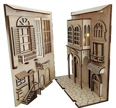 a paper cut out of a building with windows and shutters on the front door