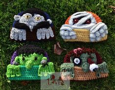 four crocheted hats sitting in the grass