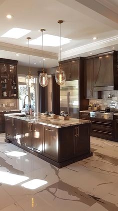 a large kitchen with marble flooring and dark wood cabinetry, along with stainless steel appliances