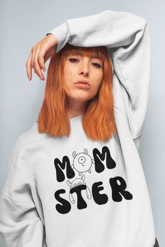 "Cute Halloween sweatshirt for mom with momster design. The perfect gift for your mom!   Size up for an oversized sweatshirt look ✦SIZES AND MEASUREMENTS * The sweatshirts are UNISEX - they are meant to have a relaxed fit. * Most women find their typical size works best * For an oversized fit, select one or two sizes up from your normal size Please check the SIZE CHART in the photo section for your measurements.  ✦MATERIALS * 8.0 oz./yd² , 50/50 cotton/polyester * Medium-heavy fabric * Spacious Casual Slogan Sweatshirt For Mother's Day, Casual Mother's Day Slogan Sweatshirt, Trendy Letter Print Sweatshirt For Mother's Day, Family Matching Graphic Print Sweatshirt, Trendy Cotton Sweatshirt For Mother's Day, Mother's Day Slogan Sweatshirt With Long Sleeves, White Long Sleeve Sweatshirt With Funny Text, Funny Cotton Sweatshirt With Cartoon Print, Sweat Oversize