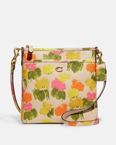 Product Details Polished pebble leather Inside open pocket Zip-top closure, fabric lining Outside open pocket Detachable strap with 23" drop for shoulder or crossbody wear 7 3/4" (L) x 8 1/4" (H) x 1" (W) Style No. CC556 Coach Floral, Polished Pebble, Coach Crossbody, Leather Handbags Crossbody, Coach Crossbody Bag, Coach Leather, Leather Messenger, Printed Leather, Floral Printed