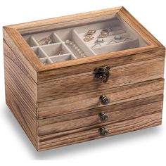 an open wooden box with jewelry in it