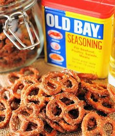 an old bay seasoning bottle next to some onion rings