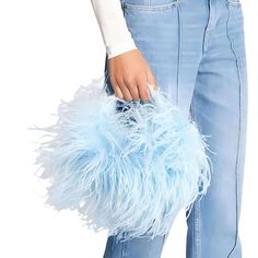 Introducing the exquisite Ostrich Feather Handbag! This bag is truly a statement piece that will elevate any outfit to a whole new level of elegance. Crafted with meticulous attention to detail, it features a lustrous pearl beaded handle that not only adds a touch of sophistication but also ensures a comfortable hold.The real showstopper of this bag is the arrangement of delicate ostrich feathers that adorn the front, creating a mesmerizing texture and adding a whimsical flair. The feathers grac Feather Circle, Simple Cocktail Dress, Throwback Fashion, Feather Accessories, Daughter Fashion, Mother Daughter Fashion, Feather Fashion, Jacket Blouse, Buy Pearls