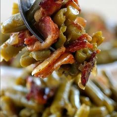 a spoon full of green beans and bacon