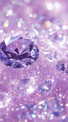 a purple diamond surrounded by diamonds on a glittery pink and white background with lots of small bubbles