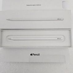 an apple macbook pro with its box opened and showing the new pen in it's packaging