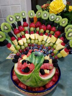 a watermelon fruit arrangement in a bowl on a table