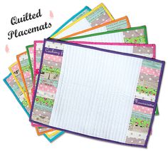 a pile of lined paper with the words quilted placemats on top of it