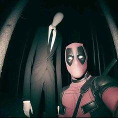 two mannequins dressed as deadpool and spider - man stand in the dark