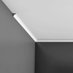 a black and white photo of a ceiling light in a room with no one on it