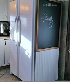 a white refrigerator freezer sitting inside of a kitchen