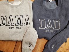 "Get one of these trending Mom Dad Est date crew neck sweatshirts with or without kids names on sleeves These are fast becoming the newest style for moms and dads this year Choose your shirt color and thread color.  Pictures shown for both.  If you prefer the ultra trendy \"tonal\" look, put that for your thread option and we have those colors already picked out to best match the shirt color 50/50 mid weight sweatshirt perfect for layering and fall nights Some items maybe substituted if they bec Personalized Long Sleeve Cotton Hoodie, Family Matching Long Sleeve Cotton Sweatshirt, Personalized Cotton Sweatshirt For Winter, Casual Sweatshirt With Letter Embroidery As Gift, Customizable Long Sleeve Sweatshirt For Father's Day, Father's Day Long Sleeve Relaxed Fit Sweatshirt, Casual Father's Day Gift Sweatshirt, Father's Day Casual Sweatshirt Gift, Casual Personalized Crew Neck Hoodie