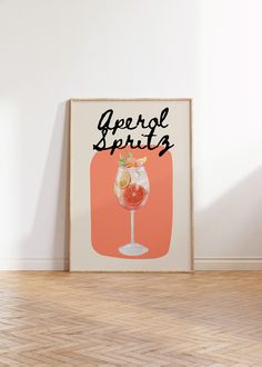 a framed poster with the words apricot sprits on it in front of a white wall