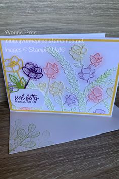 a handmade card with flowers on it