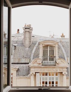 an open window looking out onto a building