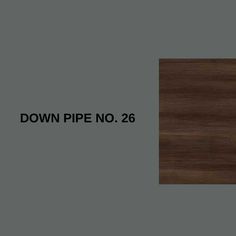 a brown wood grained surface with the words down pipe no 26