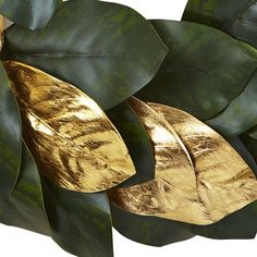 gold leaf shapes on green leaves against a white background