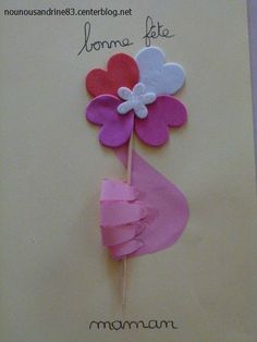 a mothers day card with paper flowers on it