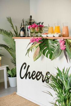 a bar with flowers and drinks on it