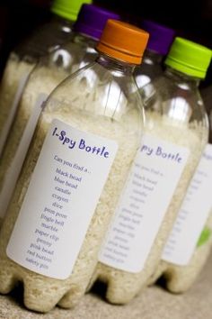 four bottles filled with rice sitting on top of a counter next to each other and labeled i - spy bowlle