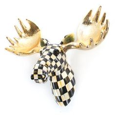 a gold and black checkered moose head brooch