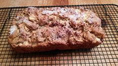 a loaf of bread sitting on top of a cooling rack