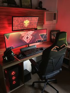 a computer desk with two monitors and a gaming chair in front of the monitor screen