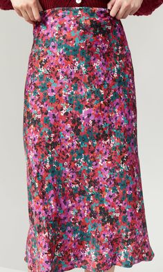 Pretty magenta floral midi-length skirt. This skirt is so feminine it would look cute styled with a white tee with a denim jacket for a more casual look or with the pom pom cardigan and your favorite heels for a chic and effortless look. Perfectly crafted and cut on a bias for a slimming effect, this skirt is great season less style that can be worn through fall and spring. 100% Rayon Sateen Model is 5'8 wearing size S Lenght: 33" Across waist: 14 1/2" Bias Cut Skirt, Midi Length Skirts, White Tee, Midi Length, Floral Skirt, Casual Looks, Sequin Skirt, Pencil Skirt, Denim Jacket