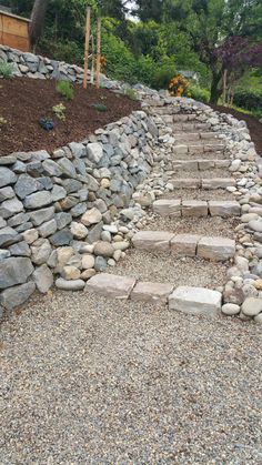 stone steps leading up to the top of a hill