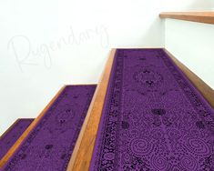 purple rugs are on the bottom of stairs