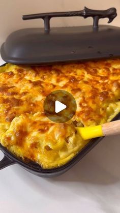 an image of a casserole being cooked in the oven with a spatula