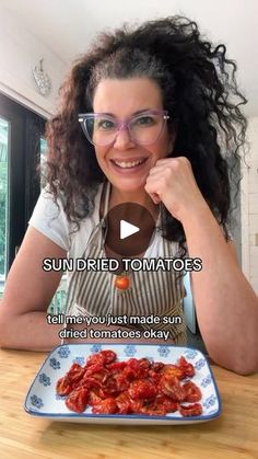 a woman with glasses sitting at a table in front of a plate of food that reads, sun dried tomatoes tell me you just made sun fried tomatoes okay