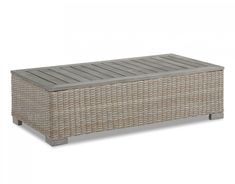 an outdoor wicker storage box with wooden slats on the top and bottom part