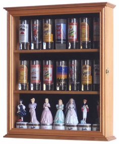 a shelf filled with lots of bottles and figurines