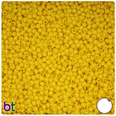 yellow plastic beads with holes in the middle