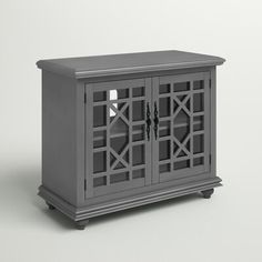 a gray cabinet sitting on top of a white floor