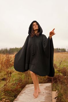 You can wear it when it's colder with a thick sweaterThis cape is made very thick Cotton materialIt is sewn from thick cachet fabric. It has a large and large hood and a giant kangaroo pocket. Hood and pocket details, sports, 3 threads raising tracksuit fabric. It is a full poncho, there is no sleeve entry. It has thick drawstring hood laces. The product is standard size and fits all sizes. It is produced in limited quantities.Model Height: 170 metersModel Size: S/M Standart size Suitable for x- Pocket Heart, Earth Craft, Black Cloak, Black Cape, Thick Sweater, Thick Sweaters, Pocket Detail, Model Height, Kangaroo Pocket