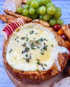 bread bowl filled with cheese, meat and vegetables