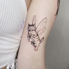 a cat and a bee tattoo on the arm