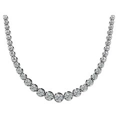 3 Carat Total Natural Diamond Riviera Graduated Tennis Necklace in 18k White Gold and Platinum. Gorgeous everyday tennis necklace with round cut, prong set diamonds all across the length surrounded by 18k white gold. Featuring a box chain on the back of the neck, with the diamond weight set on the front. Offering a large carat weight that's visible when worn that saves money without diamonds on the back. Contains a spring ring closure, weighs 11.90 grams, and is 5mm-2.5mm in width. Item Details: - Item Type: Riviera Graduated Tennis Necklace - Metal: 18 Karat White Gold; Platinum - Gemstones: Diamonds - Closure Type: Spring ring - Width: 5mm - 2.5mm - Length: 18 Inches - Weight: 11.90 grams Gemstone Details: - Type: Natural Diamond - Carat: 3.00 (approx.) - Cut: Round brilliant - Setting: White Gold Tennis Necklace With Brilliant Cut, White Gold Brilliant Cut Tennis Necklace, Platinum Tennis Necklace With Brilliant Cut, Brilliant Cut Diamond Tennis Necklace, Anniversary Round Cut Tennis Necklace With Prong Setting, Platinum Tennis Necklace With Diamond Accents, Round White Gold Tennis Necklace, Fine Jewelry Tennis Necklace With Brilliant Cut, Formal Round Diamond Necklace With Single Cut Diamonds