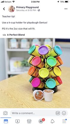 a stack of cups sitting on top of a wooden table next to a cup filled with coffee