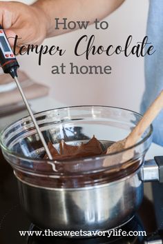 a person stirring chocolate in a large pot