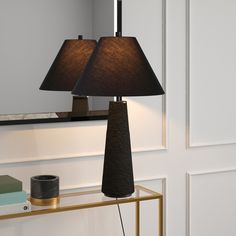 a lamp that is sitting on top of a table with a mirror in the background