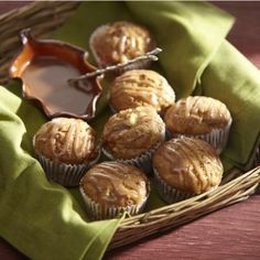 a basket filled with muffins sitting on top of a table