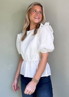 Be effortlessly stylish all year round with our Audrey Puff Sleeve Top! The textured print adds a playful touch and the ruffle details make it girly and flirty. With puff sleeves and available in two colors, wear it to work, play, or game day! True to Size Olivia is 5'6 wearing small Color: White Puff sleeves with ruffle detail Round neckline Textured print Not Lined Pull on fit Fabric: 100% Polyester Casual Puff Sleeve Top With Ruffle Hem For Brunch, Cute Ruffled Puff Sleeve Tops, Casual Puff Sleeve Top With Ruffle, Balloon Sleeve Tops With Ruffles For Day Out, White Puff Sleeve Top With Ruffles For Day Out, Cute Puff Sleeve Top With Ruffles For Spring, Cotton Puff Sleeve Top With Ruffles For Day Out, Casual Ruffled Puff Sleeve Top For Brunch, Cute White Puff Sleeve Top With Short Sleeves