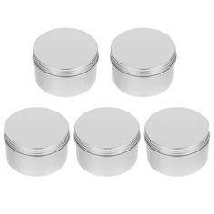 six round tins with lids on white background