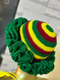 a crocheted hat on top of a mannequin head